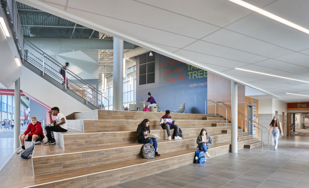 Photo of school children studying in a modern school building