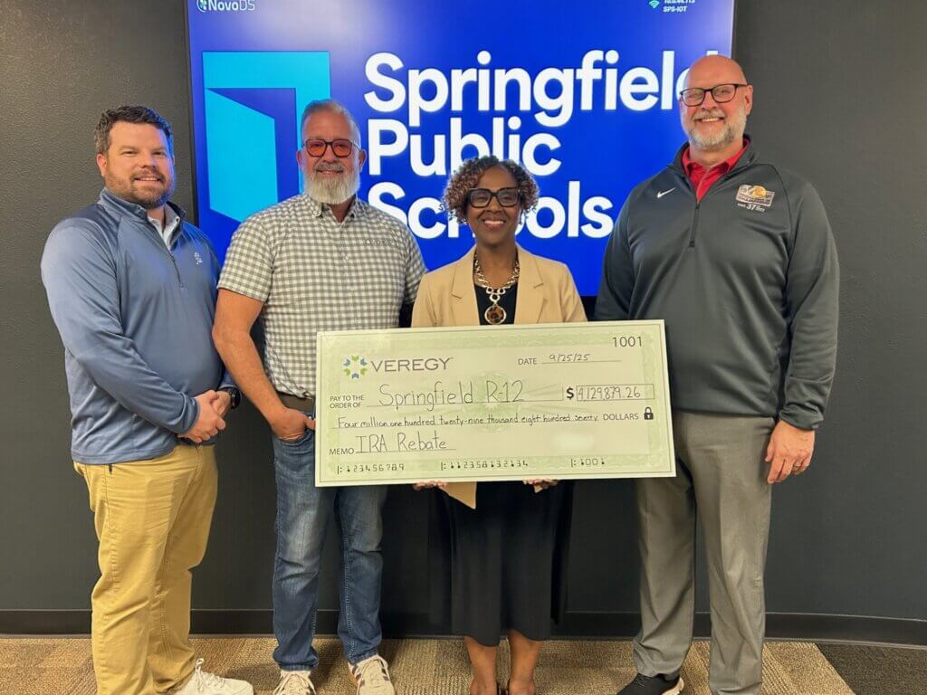 District leaders at Springfield Public Schools (Missouri) and Veregy celebrate the $4.1 million reimbursement for installing ground-source heat pumps with a ceremonial check.