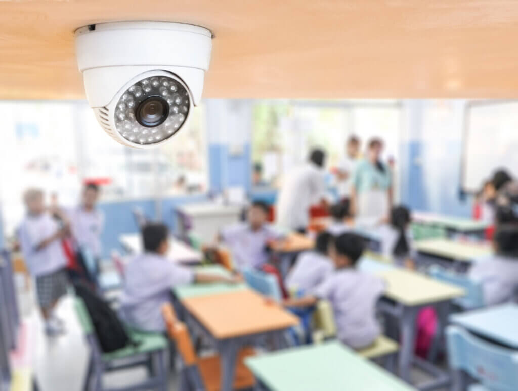 CCTV Security monitoring student in classroom at school.